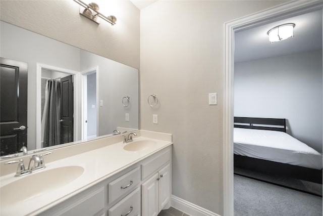 7005 Homestead Dr, Mckinney, TX 75070 - ensuite bathroom with a sink, baseboards, ensuite bathroom, and double vanity