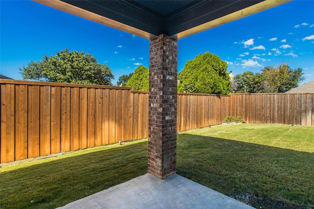 view of yard featuring a patio and a fenced backyard
