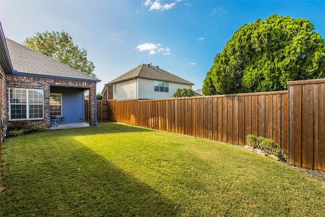view of yard with a patio and a fenced backyard