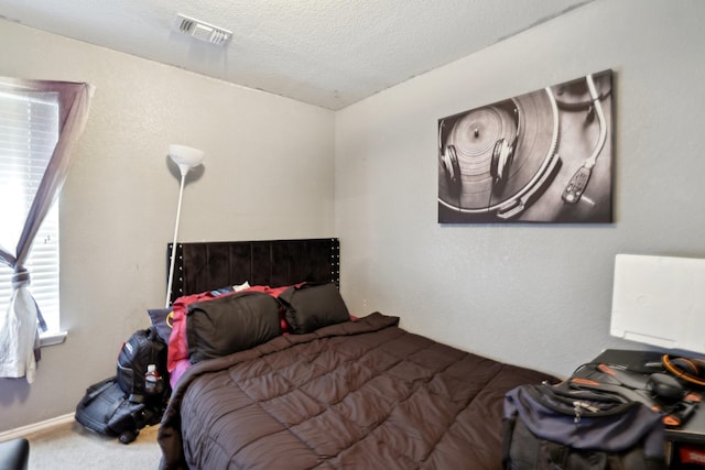 8633 Trinity Vista Trl, Fort Worth, TX 76053 - carpeted bedroom with a textured ceiling