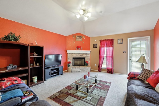 8633 Trinity Vista Trl, Fort Worth, TX 76053 - carpeted living room featuring a ceiling fan, lofted ceiling, a brick fireplace, and baseboards