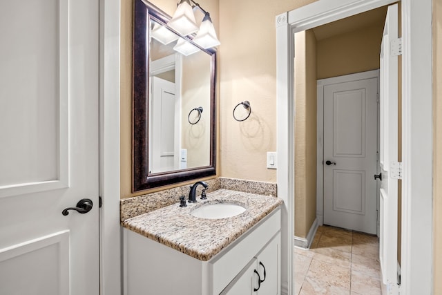 bathroom featuring vanity and baseboards