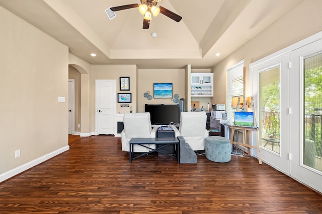 sitting room with a ceiling fan, wood finished floors, arched walkways, lofted ceiling, and recessed lighting