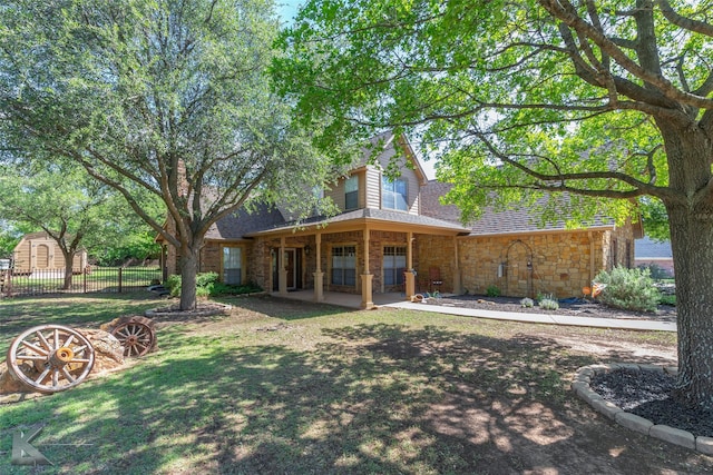 270 Alexandra Dr, Tuscola, TX 79562 - rear view of house with a shingled roof and stone siding