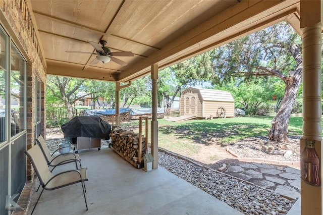 270 Alexandra Dr, Tuscola, TX 79562 - view of patio featuring ceiling fan, a shed, and an outdoor structure