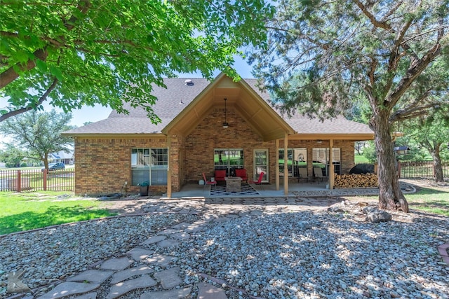 270 Alexandra Dr, Tuscola, TX 79562 - back of house featuring a patio, fence, roof with shingles, and brick siding