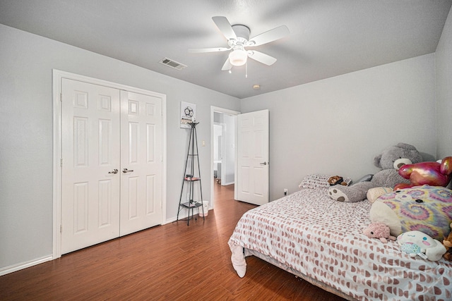 2100 Leandra Ln, Fort Worth, TX 76131 - bedroom featuring visible vents, a closet, wood finished floors, baseboards, and ceiling fan