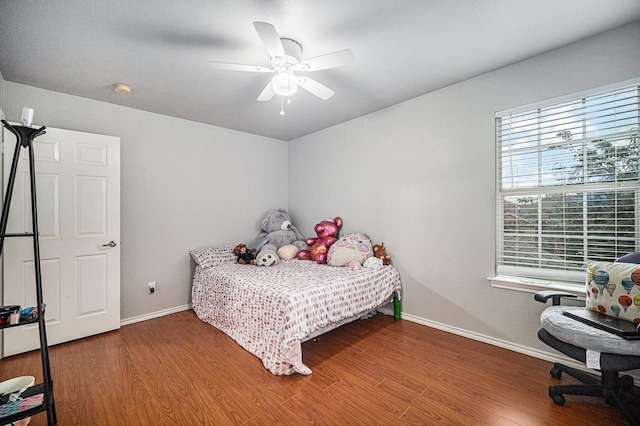 2100 Leandra Ln, Fort Worth, TX 76131 - bedroom with baseboards, ceiling fan, and wood finished floors