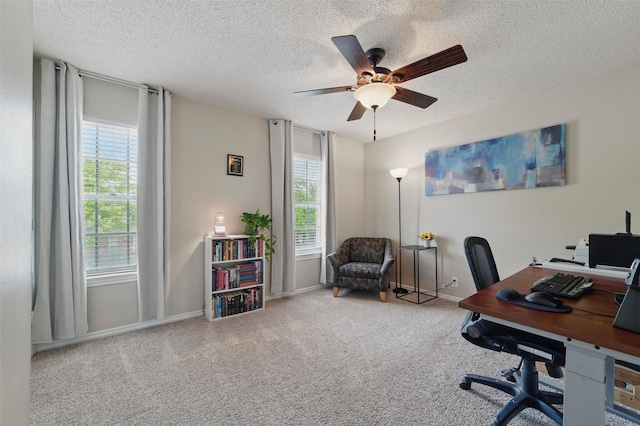 home office with a ceiling fan, a textured ceiling, and a wealth of natural light