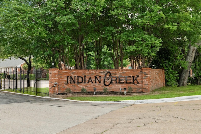 community sign with fence