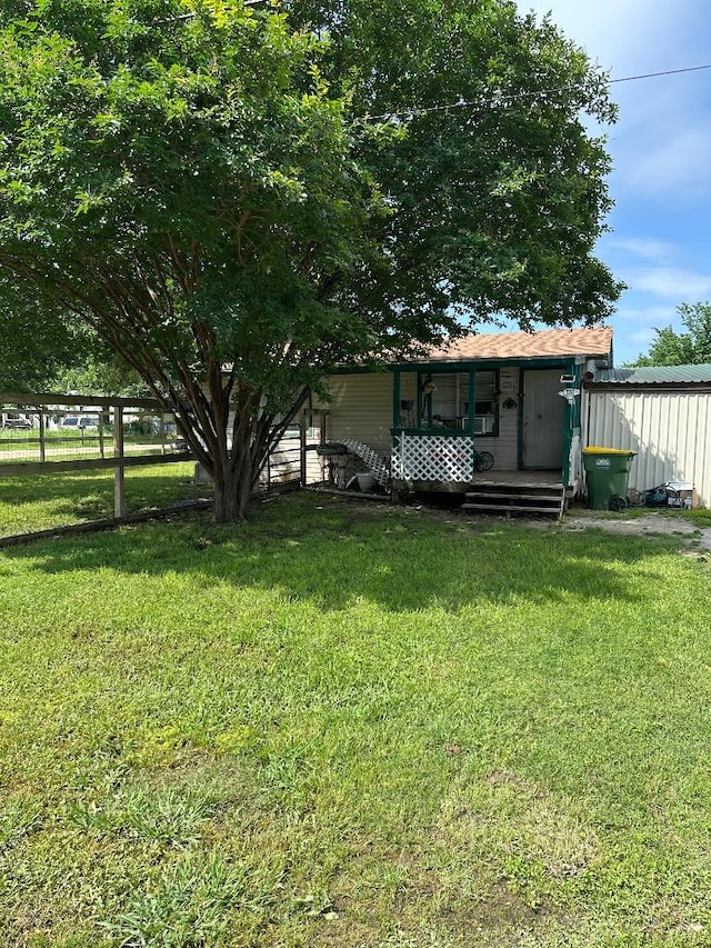 view of yard with covered porch