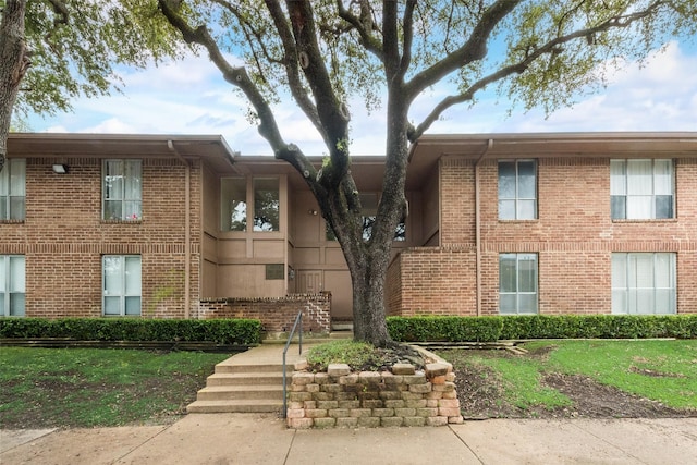 view of front of home featuring brick siding