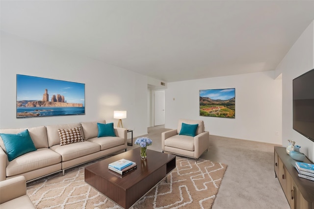 living room with carpet flooring and visible vents