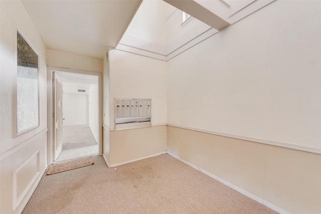 corridor featuring carpet floors and baseboards