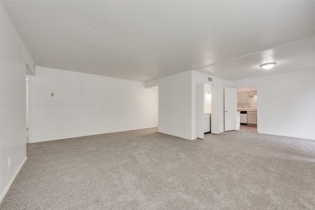 unfurnished living room with light colored carpet and visible vents