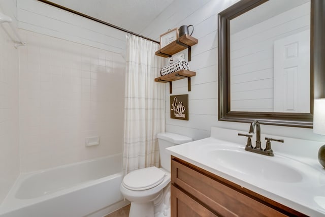 bathroom with toilet, shower / bath combo, and vanity