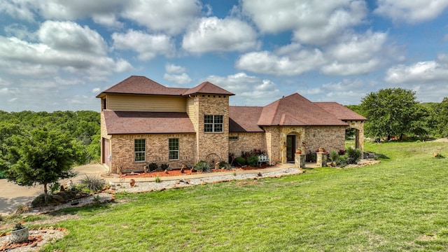 view of front of house with brick siding and a front yard