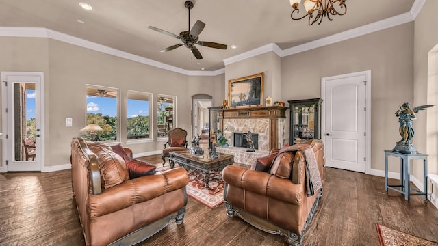 living area with recessed lighting, a fireplace, ceiling fan with notable chandelier, and dark wood-style flooring