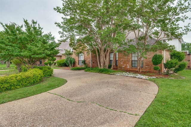 908 Willow Brook Dr, Allen, TX 75002 - view of front of house featuring brick siding, a front lawn, roof with shingles, and driveway