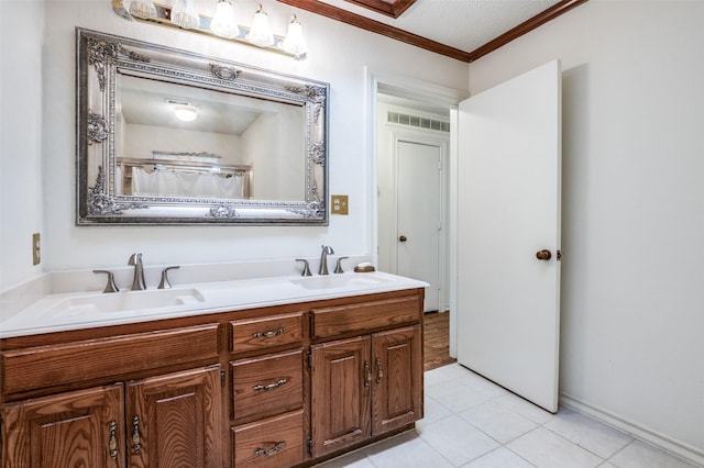 908 Willow Brook Dr, Allen, TX 75002 - full bathroom with double vanity, a sink, crown molding, and tile patterned floors