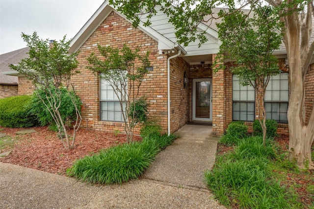 908 Willow Brook Dr, Allen, TX 75002 - doorway to property featuring a porch and brick siding
