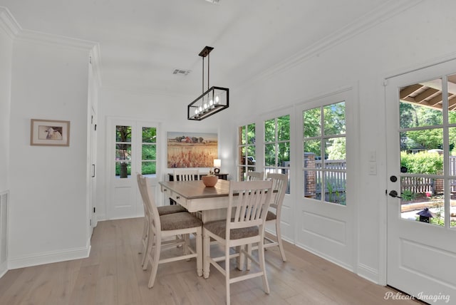 314 Gentilly Cir, Shreveport, LA 71106 - dining room with light wood-style floors, ornamental molding, and plenty of natural light