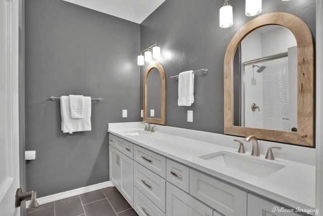 314 Gentilly Cir, Shreveport, LA 71106 - bathroom with double vanity, a shower with door, a sink, and tile patterned flooring