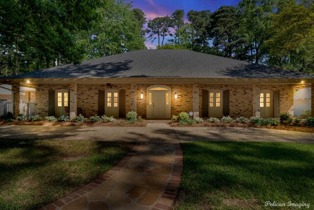 314 Gentilly Cir, Shreveport, LA 71106 - ranch-style home featuring french doors, a yard, roof with shingles, and brick siding