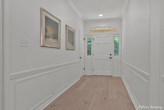 314 Gentilly Cir, Shreveport, LA 71106 - doorway to outside with crown molding, wainscoting, light wood-style floors, a decorative wall, and recessed lighting