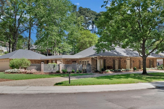 314 Gentilly Cir, Shreveport, LA 71106 - single story home featuring brick siding, a garage, and a fenced front yard