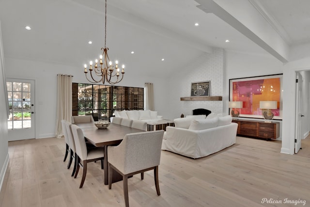 314 Gentilly Cir, Shreveport, LA 71106 - dining room with an inviting chandelier, beam ceiling, a fireplace, baseboards, and light wood finished floors