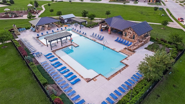 view of pool with fence and a gazebo
