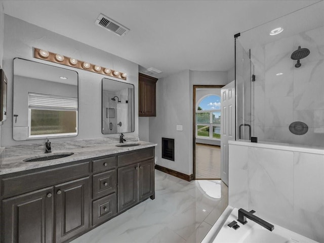 bathroom featuring visible vents, a sink, marble finish floor, and a stall shower
