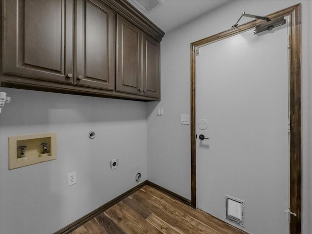 laundry room featuring wood finished floors, baseboards, hookup for an electric dryer, cabinet space, and washer hookup