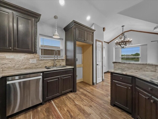 kitchen featuring dark brown cabinets, a sink, dishwasher, a chandelier, and decorative backsplash