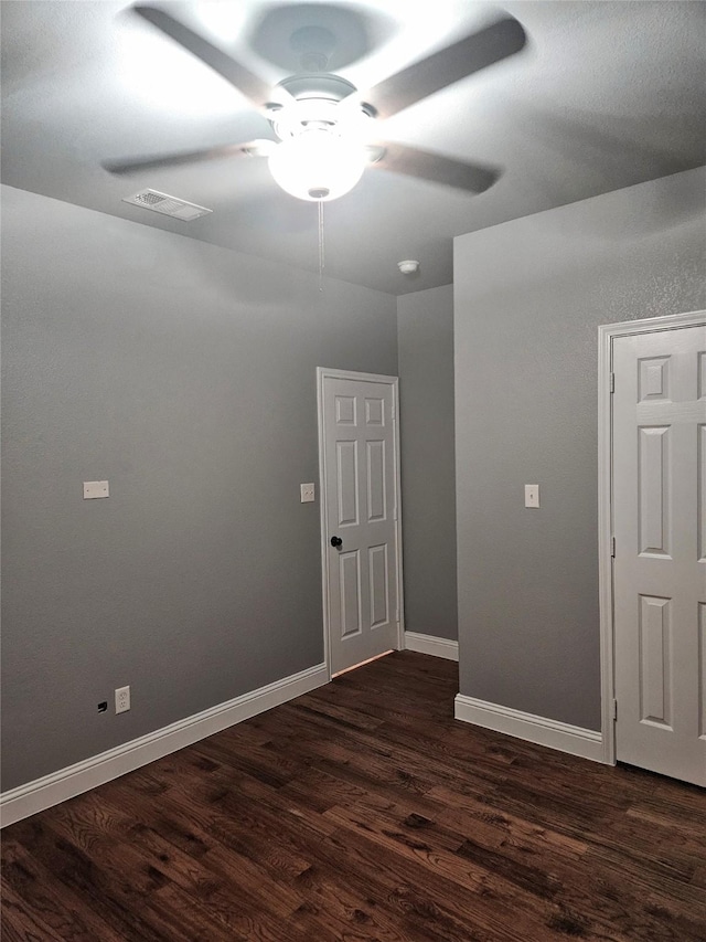 2120 Rw Bivens Ln, Fort Worth, TX 76105 - empty room featuring a ceiling fan and dark wood-style flooring