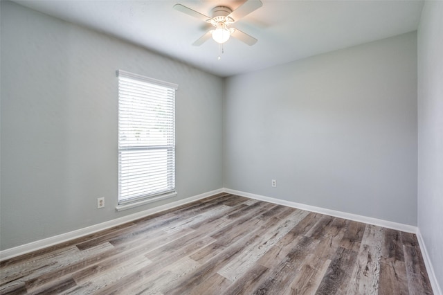 1200 Kesser Dr, Plano, TX 75025 - unfurnished room featuring a wealth of natural light, wood finished floors, baseboards, and ceiling fan