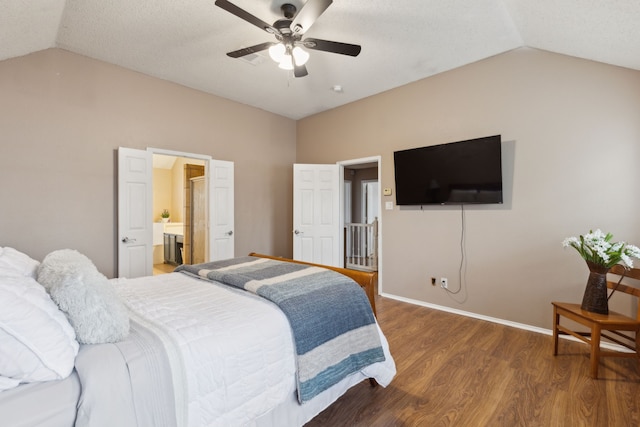 bedroom with wood finished floors, a ceiling fan, baseboards, and lofted ceiling