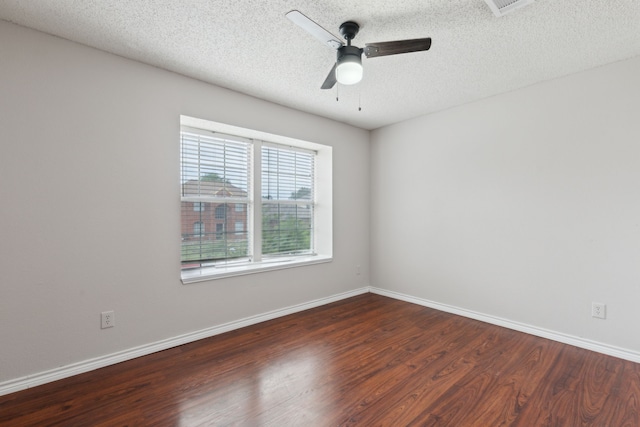 empty room featuring baseboards, ceiling fan, a textured ceiling, and wood finished floors