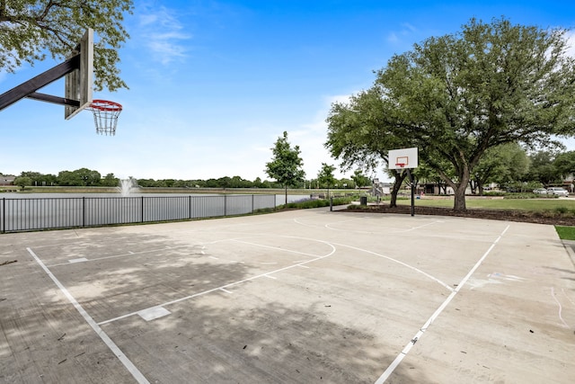 view of sport court featuring community basketball court and fence