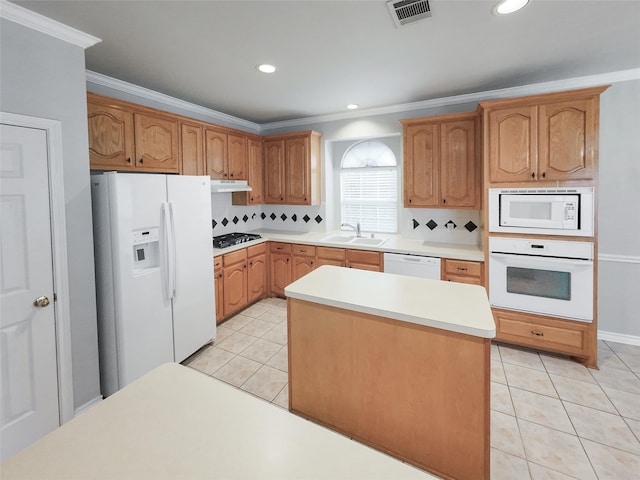 kitchen featuring visible vents, light tile patterned floors, under cabinet range hood, and white appliances