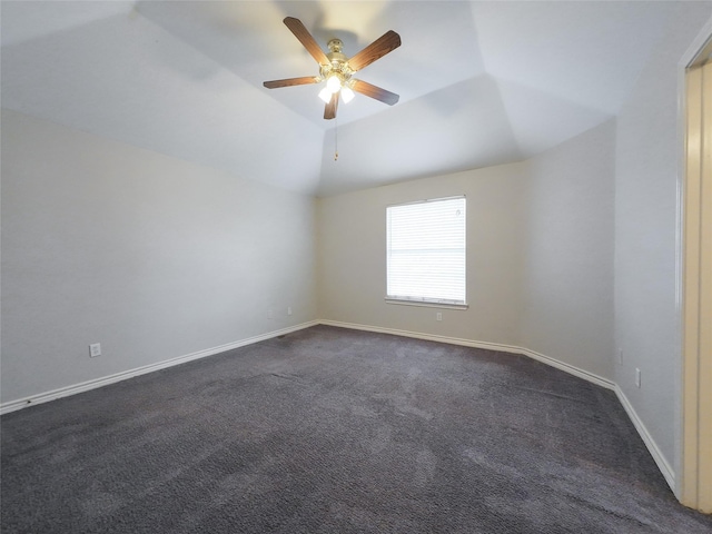 unfurnished room with baseboards, ceiling fan, and dark colored carpet