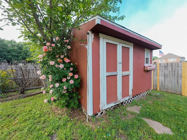 view of shed featuring a fenced backyard