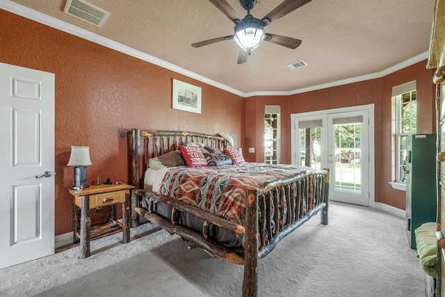 bedroom with visible vents, a textured wall, carpet floors, and access to exterior