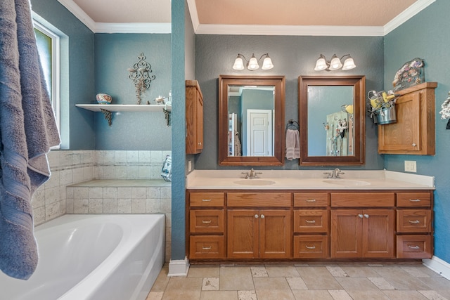 bathroom featuring crown molding, a sink, and a garden tub