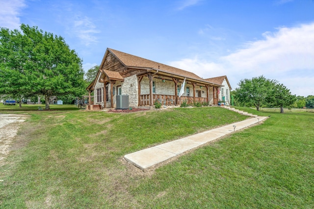 view of home's exterior with covered porch, a lawn, stone siding, and central air condition unit