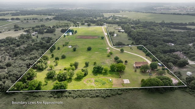 birds eye view of property featuring a rural view