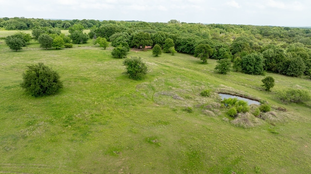 birds eye view of property with a rural view