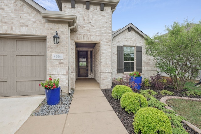 3004 Culver Ave, Celina, TX 75009 - doorway to property featuring stone siding and a garage