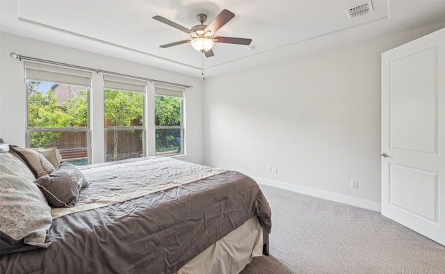 3004 Culver Ave, Celina, TX 75009 - bedroom featuring a ceiling fan, visible vents, baseboards, a tray ceiling, and carpet flooring